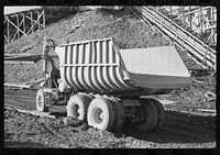 Dump truck which carries materials for use in construction of Shasta Dam, Shasta County, California. This truck uses butane instead of gasoline because of the extra power butane gives by Russell Lee