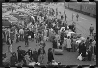 Los Angeles, California. The evacuation of the Japanese-Americans from West Coast areas under U.S. Army war emergency order. Japanese-Americans and a few alien Japanese waiting for a train which will take them to Owens Valley by Russell Lee