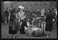 [Untitled photo, possibly related to: Los Angeles, California. Japanese-American evacuation from West Coast areas under U.S. Army war emergency order. Waiting with their luggage at the old Santa Fe station for a train to take them to Owens Valley] by Russell Lee