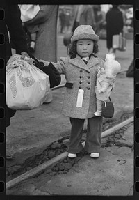 Los Angeles, California. Japanese-American evacuation from West Coast areas under U.S. Army war emergency order. Japanese-American child who will go with his parents to Owens Valley by Russell Lee