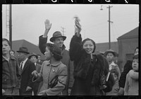 Los Angeles, California. Japanese-American evacuation from West Coast areas under U.S. Army war emergency order. Waving good-bye to friends and relatives who are leaving for Owens Valley by Russell Lee