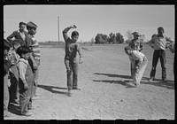 Top spinning contest at the annual field day of the FSA (Farm Security Administration) farmworkers community, Yuma, Arizona by Russell Lee
