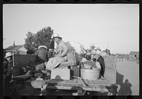 Nyssa, Oregon. FSA (Farm Security Administration) mobile camp. Japanese-American farm workers leaving the camp by Russell Lee