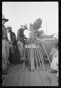 Nyssa, Oregon. FSA (Farm Security Administration) mobile camp. Japanese-American farm workers ready to leave for the fields. The farmers send trucks to the camp to pick them up by Russell Lee