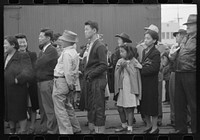 Los Angeles, California. The evacuation of Japanese-Americans from West Coast areas under U.S. Army war emergency order. Japanese-Americans watching train taking their friends and relatives to Owens Valley by Russell Lee