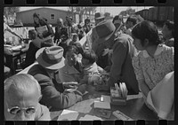 Santa Anita reception center, Los Angeles, California. The evacuation of Japanese and Japanese-Americans from West Coast areas under U.S. Army war emergency order. Registering Japanese-Americans as they arrive by Russell Lee