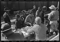 Santa Anita reception center, Los Angeles, California. The evacuation of Japanese and Japanese-Americans from West Coast areas under U.S. Army war emergency order. Registering Japanese-Americans upon arrival by Russell Lee