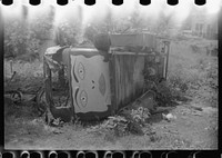 Strange painting on a wrecked car. Swepsonville, North Carolina. Sourced from the Library of Congress.