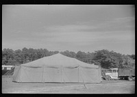 Traveling carnival at Old Trap, North Carolina. This troupe follows the migrants around and stops where there is a large settlement of them. A show generally consists of a band concert and movie and vaudeville. Sourced from the Library of Congress.