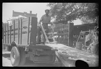 [Untitled photo, possibly related to: An outdoor potato grader using migratory labor. At the freight station in Elizabeth City, North Carolina]. Sourced from the Library of Congress.