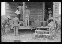 Migratory crew of agricultural workers waiting to leave on their truck from Belcross, North Carolina to Onley, Virginia. Sourced from the Library of Congress.