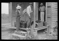Migrants with their luggage preparing to leave Belcross, North Carolina for another job at Onley, Virginia. Sourced from the Library of Congress.