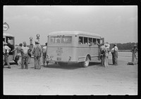 [Untitled photo, possibly related to: Migratory bean pickers being loaded into school buses for transportation to the bean fields. Statensville, Delaware]. Sourced from the Library of Congress.