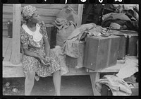 Georgia migratory agricultural worker waiting for the truck which will take her to another job at Onley, Virginia. Near Belcross, North Carolina. Sourced from the Library of Congress.