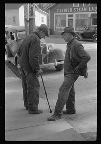 [Untitled photo, possibly related to: Two potato farmers in town Saturday afternoon in Caribou, Maine]. Sourced from the Library of Congress.