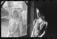 Two of the Dumond children at the back door of their home in Lille, Maine. French-Canadian potato farmers and FSA (Farm Security Administration) clients. Sourced from the Library of Congress.
