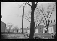 [Untitled photo, possibly related to: A street in Taftville, Connecticut, during the changing of the shift at the textile mill]. Sourced from the Library of Congress.