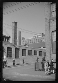 [Untitled photo, possibly related to: Employees leaving Brown and Sharpe Manufacturing Company, Providence, Rhode Island]. Sourced from the Library of Congress.