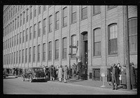 Employees leaving Brown and Sharpe Manufacturing Company, Providence, Rhode Island. Sourced from the Library of Congress.
