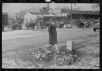 [Untitled photo, possibly related to: Farmer at the Governor Dyer market keeping warm around a fire, Providence, Rhode Island]. Sourced from the Library of Congress.