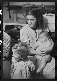 Wife and children of Dennis Decosta, Portugese FSA (Farm Security Administration) client, owns twelve cows on a small farm in Little Compton, Rhode Island. Sourced from the Library of Congress.