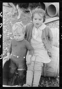 [Untitled photo, possibly related to: Child of a French-Canadian potato farmer in Soldier Pond, Maine]. Sourced from the Library of Congress.