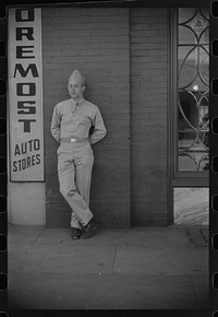 [Untitled photo, possibly related to: Soldier from Fort Benning on a street in Columbus, Georgia]. Sourced from the Library of Congress.