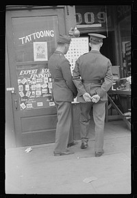 [Untitled photo, possibly related to: Soldiers from Fort Benning on a street in Columbus, Georgia]. Sourced from the Library of Congress.