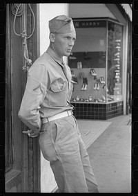 [Untitled photo, possibly related to: Soldier from Fort Benning on a street in Columbus, Georgia]. Sourced from the Library of Congress.