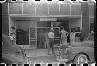 Workmen from a nearby powder plant at the post office in Childersburg, Alabama. Sourced from the Library of Congress.