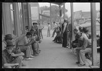 Workers, some of them unemployed, on the main street of Childersburg, Alabama. Sourced from the Library of Congress.