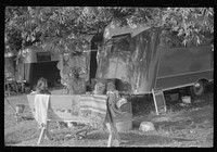 In a trailer camp in Childersburg, Alabama. Many workmen and their families living here are either waiting for job openings or already have jobs at the nearby powder plant. Sourced from the Library of Congress.
