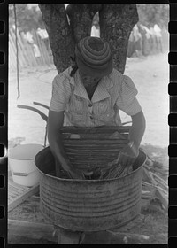 [Untitled photo, possibly related to: Tenant farmer's wife washing clothes, Greene County, Georgia]. Sourced from the Library of Congress.