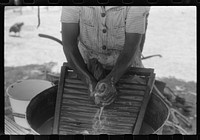 [Untitled photo, possibly related to: Tenant farmer's wife washing clothes, Greene County, Georgia]. Sourced from the Library of Congress.