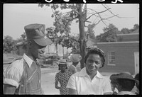 [Untitled photo, possibly related to: Saturday afternoon outside of a  store and barbershop in Union Point, Greene County, Georgia]. Sourced from the Library of Congress.
