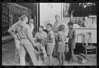 [Untitled photo, possibly related to: Soldiers getting their shoes shined in Fredericksburg, Virginia]. Sourced from the Library of Congress.