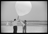 [Untitled photo, possibly related to: Preparing to send up the weather balloon at the weather bureau at the municipal airport in Washington, D.C.]. Sourced from the Library of Congress.