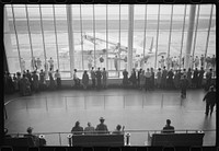 [Untitled photo, possibly related to: Visitors watching planes. Seen from waiting platform at the municipal airport in Washington, D.C.]. Sourced from the Library of Congress.