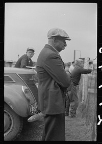 [Untitled photo, possibly related to: Spectator at the auto races at the Champlain Valley Exposition at Essex Junction, Vermont]. Sourced from the Library of Congress.