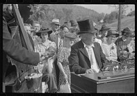 [Untitled photo, possibly related to: Playing on old organ for the period dances at the "World's Fair" in Tunbridge, Vermont]. Sourced from the Library of Congress.