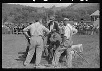 [Untitled photo, possibly related to: Tunbridge, Vermont. Weight-pulling contest for horses at the "World's Fair"]. Sourced from the Library of Congress.