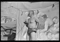 [Untitled photo, possibly related to: Wrestlers at the "World's Fair" in Tunbridge, Vermont]. Sourced from the Library of Congress.