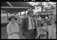 [Untitled photo, possibly related to: Family at the Greene County fair in Greensboro, Georgia]. Sourced from the Library of Congress.