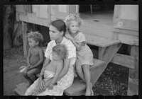 Family in slum area known as "El Machuelitto," in Ponce, Puerto Rico. Sourced from the Library of Congress.