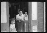 [Untitled photo, possibly related to: Storekeeper and his wife in the slum area known as "El Machuelitto" in Ponce, Puerto Rico]. Sourced from the Library of Congress.