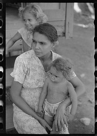 [Untitled photo, possibly related to: Family in slum area known as "El Machuelitto," in Ponce, Puerto Rico]. Sourced from the Library of Congress.