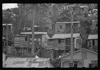 Houses in slum area in Orocovis, Puerto Rico. Sourced from the Library of Congress.