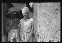 [Untitled photo, possibly related to: Old woman living in one of the slum "villages" in the northwestern part of the island. St. Croix, Virgin Islands]. Sourced from the Library of Congress.