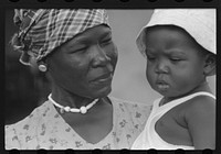 Wife and child of a FSA (Farm Security Administration) borrower living in a homestead house near Fredericksted, St. Croix, Virgin Islands. Sourced from the Library of Congress.