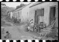 [Untitled photo, possibly related to: Old slave quarters still being used in one of the slum "villages," St. Croix, Virgin Islands]. Sourced from the Library of Congress.